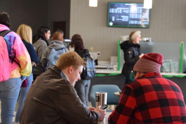 Students waiting outside Starbucks at Shake Resource Center